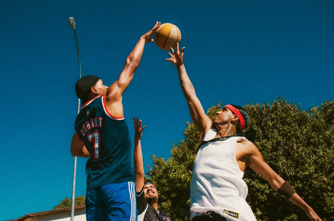 Young People Playing Basketball Outdoors